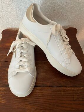 Skechers Like New! White with gold accent. Great to wear with dresses!